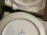 two plates and a bowl sitting on a table
