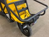 a yellow scooter that is parked in a garage