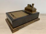 a small wooden box with a train on it