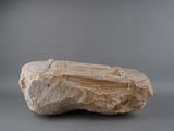 a rock that is sitting on a gray surface