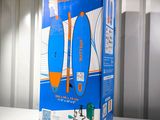 a box with a surfboard inside of it on a table