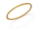 a close up of a gold bracelet on a white background
