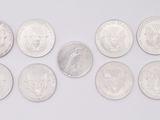 six different types of silver coins arranged in a row