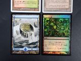 three cards are sitting on top of a table next to each other