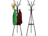 a pair of coat stands with hats and coats on them