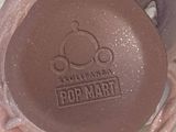 a brown pot that is sitting on top of a table