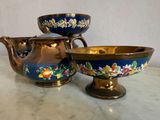 two bowls and a teapot sitting on a table