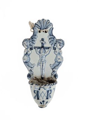 a blue and white vase with a bird on it