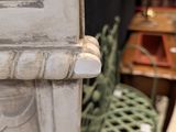 a close up of a piece of furniture with a clock on it