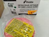 a pink object in a plastic bag on a table