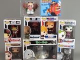 a bunch of pop vinyl figures in a display case
