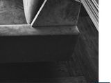 a black and white photo of a couch in a living room
