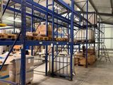 a large warehouse filled with lots of boxes and pallets