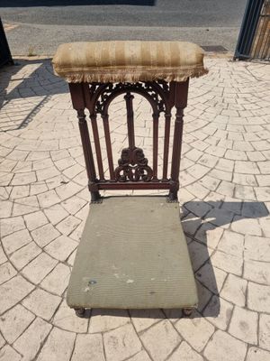 a chair that is sitting in the middle of the street
