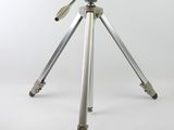a tripod with a camera on it on a white background