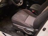 the interior of a car with the door open and the driver ' s seat up