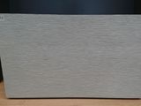 a white box sitting on top of a wooden table