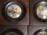 four plates with a picture of a man and a woman on them