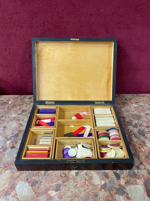 a wooden box with many different items in it