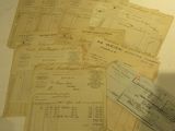 some papers are sitting on top of a table next to a keyboard