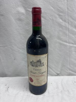a bottle of wine that is sitting on a table