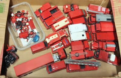 a box full of toy firetrucks and trucks in it