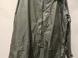 an image of a jacket hanging on a hanger on a wall