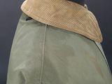 a close up of a jacket with a collar on a mannequin dummy
