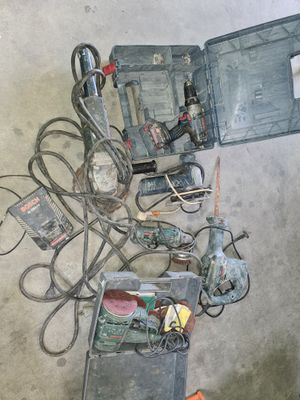 a lot of tools that are laying out on the floor