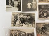 several old black and white photographs of people and animals on a wall