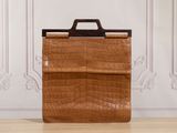 an image of a brown briefcase sitting on top of a wooden floor