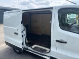 a white van with its door open in a parking lot