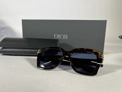 a close up of a pair of sunglasses on a table