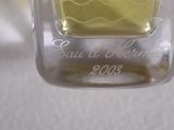 a glass jar with a yellow liquid inside of it