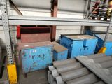 many different types of steel pipes in a warehouse