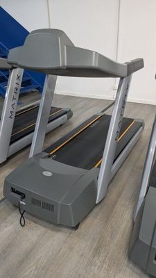 two tread machines that are on the floor in the room