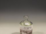 a small bottle of liquor sitting on a table