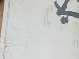 an old book with a picture of a bird sitting on a tree branch