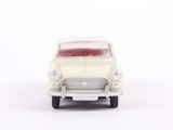 a toy car that is sitting on a white surface