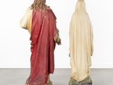 two statues of jesus and a woman in a red cloak
