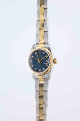 an image of a lady ' s wrist watch with a blue dial