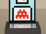 an old game console with a floppy disk on top of it
