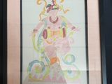 framed drawing of a woman in a dress with a hat on