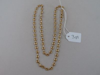 a close up of a gold chain with a price tag on it