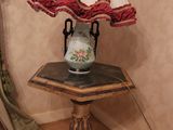 a lamp that is sitting on a table in a room