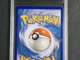 a close up of a pokemon card in a plastic case