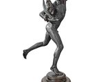 bronze statue of a woman holding a child on a pedestal