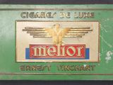 an image of a green cigarette box with a gold eagle on it