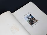 an open book with a picture of a man riding a bike