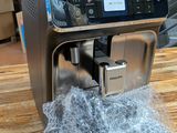 a coffee machine that is sitting on a wooden table